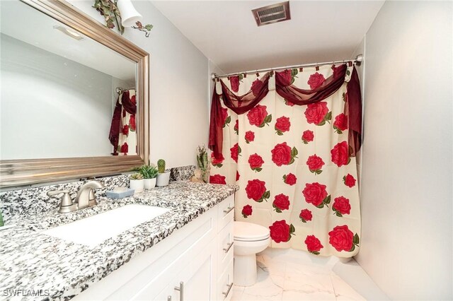 402 SE 42nd Ter Unit D 5, Cape Coral, FL 33904 - bathroom with marble finish floor, visible vents, toilet, and vanity