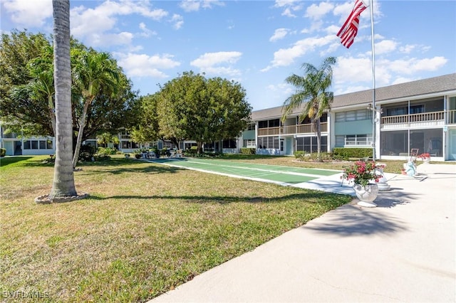 402 SE 42nd Ter Unit D 5, Cape Coral, FL 33904 - view of community featuring a lawn and shuffleboard
