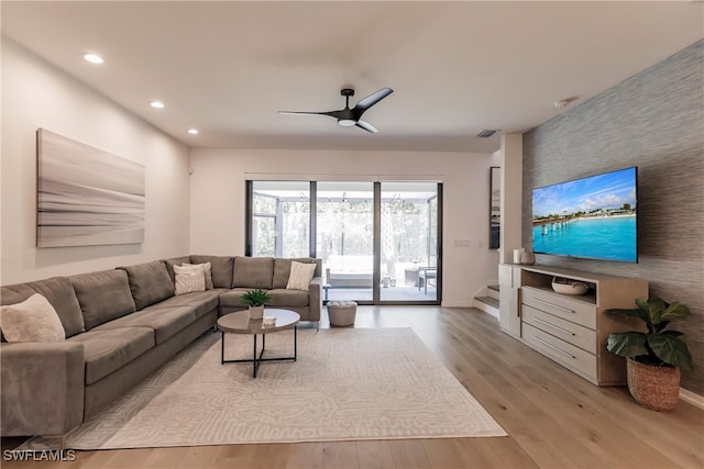 13005 Pembroke Dr, Naples, FL 34105 - living room with visible vents, ceiling fan, wood finished floors, recessed lighting, and an accent wall