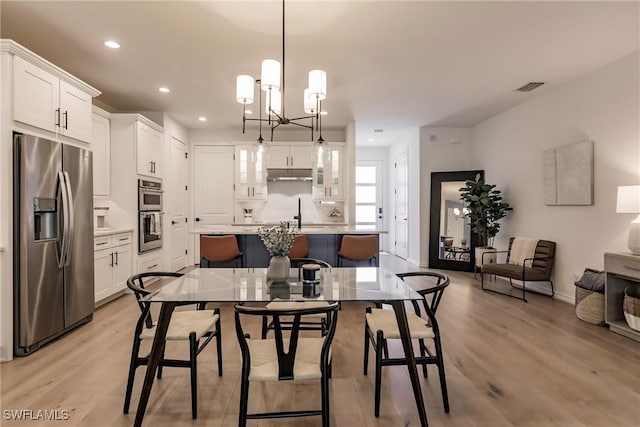 13005 Pembroke Dr, Naples, FL 34105 - dining room featuring baseboards, visible vents, light wood-style flooring, and recessed lighting