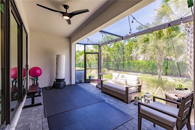 13005 Pembroke Dr, Naples, FL 34105 - sunroom / solarium featuring an outdoor hangout area and a ceiling fan