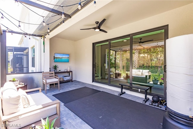 13005 Pembroke Dr, Naples, FL 34105 - view of patio featuring a ceiling fan and outdoor lounge area