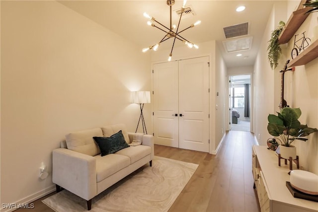 13005 Pembroke Dr, Naples, FL 34105 - living area featuring baseboards, visible vents, and light wood finished floors
