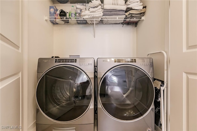13005 Pembroke Dr, Naples, FL 34105 - clothes washing area featuring washer and dryer and laundry area