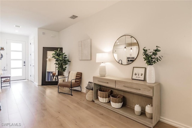 13005 Pembroke Dr, Naples, FL 34105 - sitting room featuring baseboards, visible vents, and wood finished floors