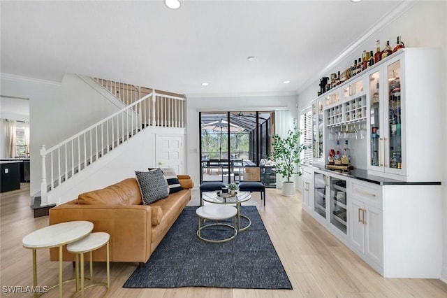 living area with light wood finished floors, stairs, crown molding, and recessed lighting