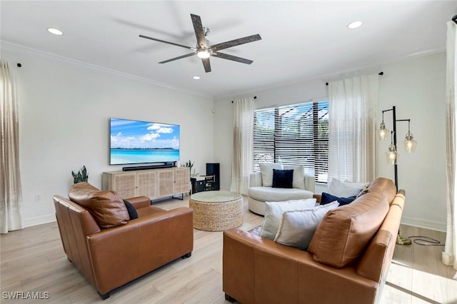 living area featuring a ceiling fan, light wood-style floors, and recessed lighting