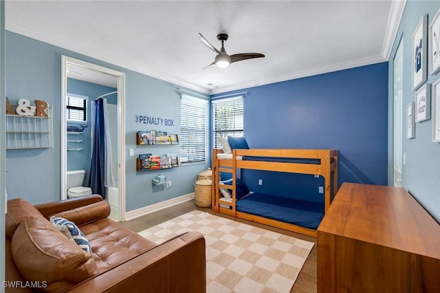bedroom with baseboards, ceiling fan, and crown molding