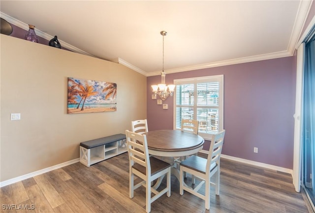 931 SW 35th Ter, Cape Coral, FL 33914 - dining area featuring crown molding, a chandelier, and wood finished floors
