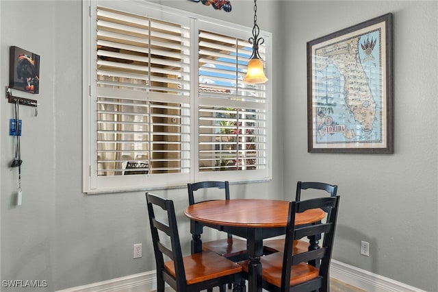 dining room with baseboards