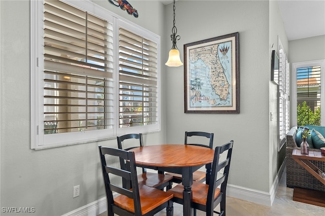 dining room featuring baseboards