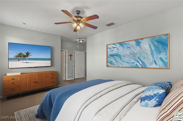 carpeted bedroom featuring visible vents and a ceiling fan