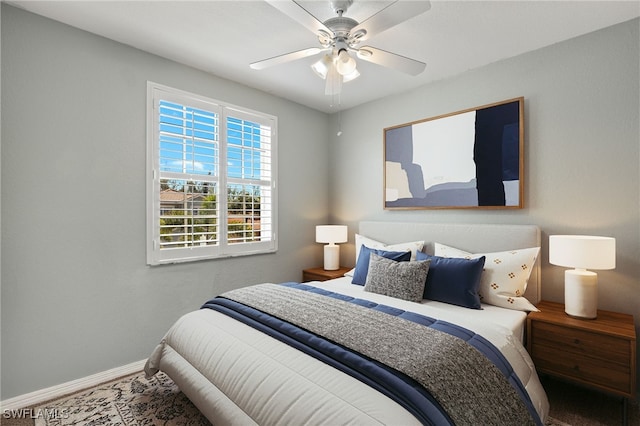 bedroom featuring baseboards and a ceiling fan