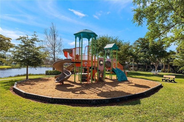 communal playground featuring a water view and a yard