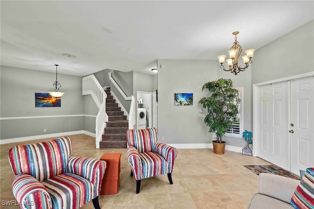 entrance foyer with an inviting chandelier, washer / clothes dryer, baseboards, and stairs