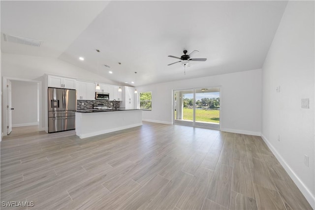 unfurnished living room featuring lofted ceiling, visible vents, light wood-type flooring, and a ceiling fan