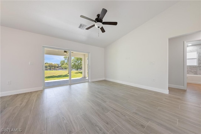 spare room with light wood-style flooring, baseboards, ceiling fan, and visible vents