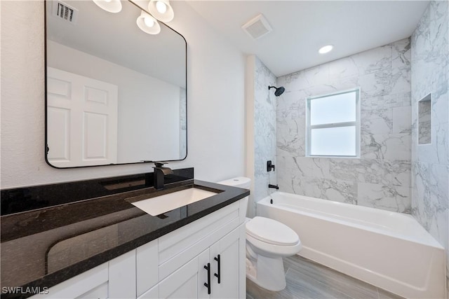 full bath featuring bathtub / shower combination, visible vents, toilet, and vanity