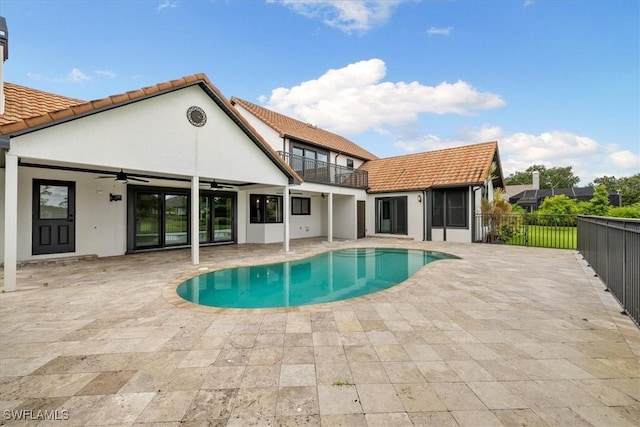 view of pool with a ceiling fan, a fenced in pool, fence, and a patio