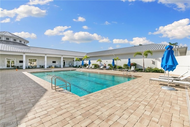 community pool with a patio area