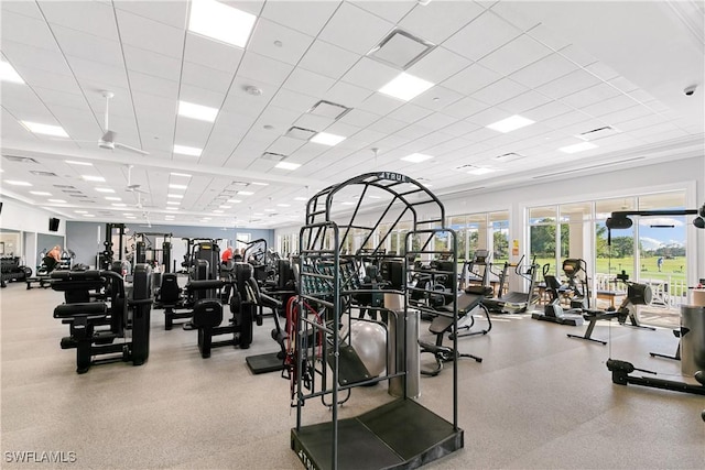 gym with visible vents and a paneled ceiling