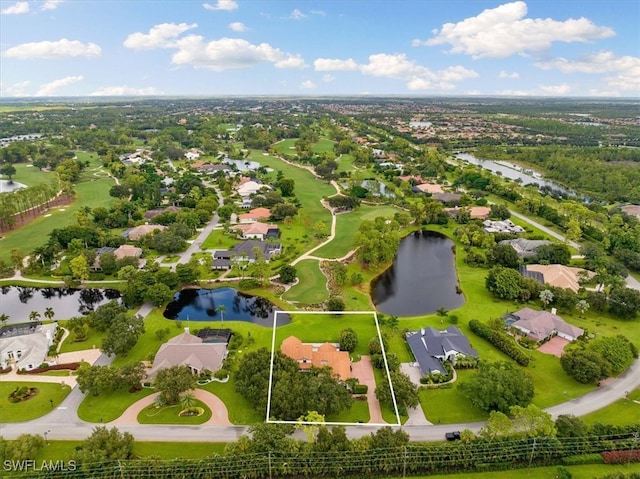 aerial view with a residential view and a water view