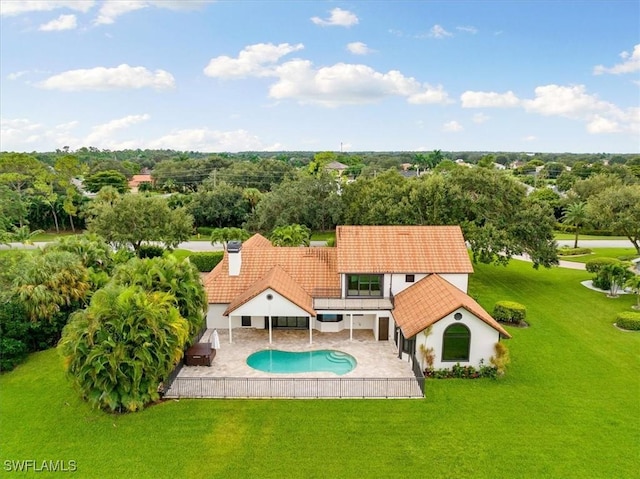 view of pool featuring a patio, a fenced in pool, and a yard