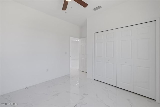 1508 Hibiscus Ave, Lehigh Acres, FL 33972 - unfurnished bedroom with marble finish floor, visible vents, a closet, and ceiling fan