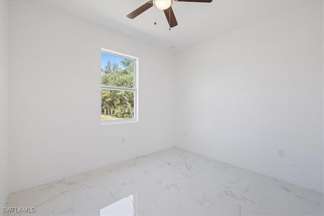 1508 Hibiscus Ave, Lehigh Acres, FL 33972 - unfurnished room featuring marble finish floor, baseboards, and ceiling fan