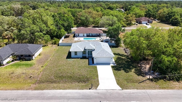 1508 Hibiscus Ave, Lehigh Acres, FL 33972 - bird's eye view featuring a forest view