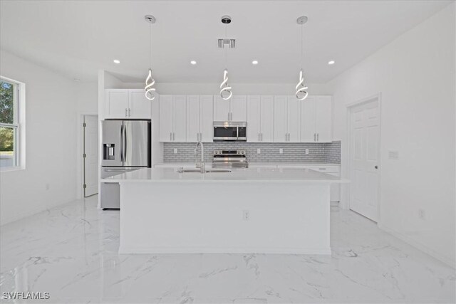 1508 Hibiscus Ave, Lehigh Acres, FL 33972 - kitchen with marble finish floor, visible vents, a sink, and appliances with stainless steel finishes