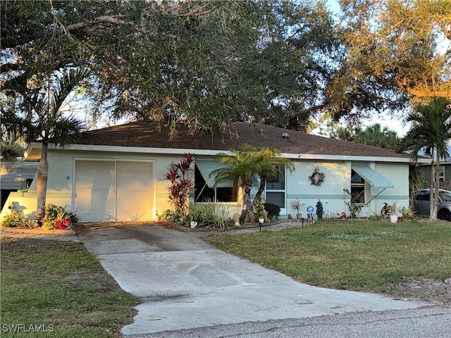 1148 Barbour Ave, Port Charlotte, FL 33948 - ranch-style home featuring a front lawn, stucco siding, and driveway