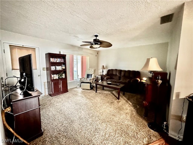 1148 Barbour Ave, Port Charlotte, FL 33948 - living area featuring ceiling fan, carpet floors, and a textured ceiling