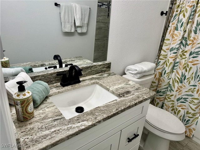 17304 Timber Oak Ln, Fort Myers, FL 33908 - full bath with a textured wall, toilet, vanity, and a shower with curtain