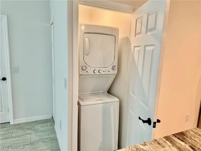 17304 Timber Oak Ln, Fort Myers, FL 33908 - laundry room featuring laundry area and stacked washer / drying machine