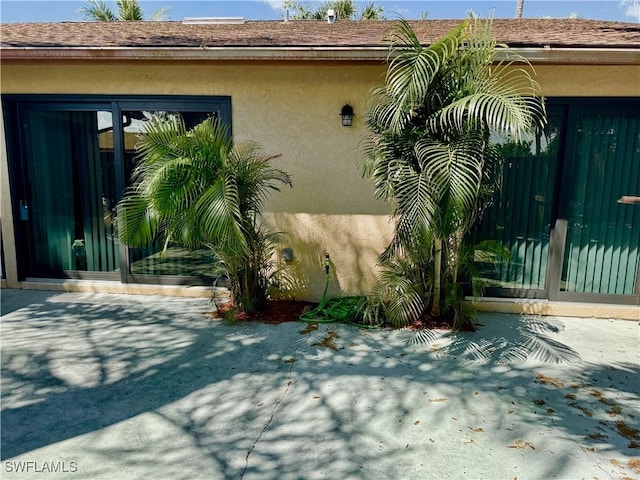 17304 Timber Oak Ln, Fort Myers, FL 33908 - view of side of property featuring stucco siding