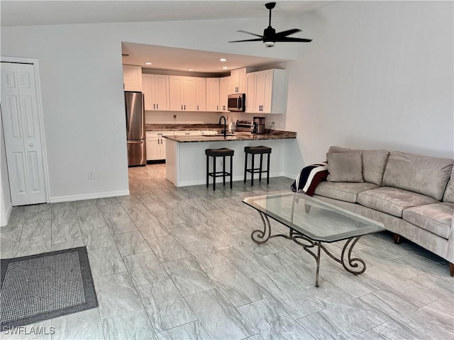 17304 Timber Oak Ln, Fort Myers, FL 33908 - living room featuring a ceiling fan, baseboards, vaulted ceiling, and recessed lighting