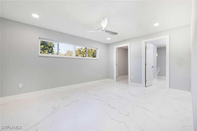 unfurnished bedroom with ensuite bath, ceiling fan, baseboards, and recessed lighting