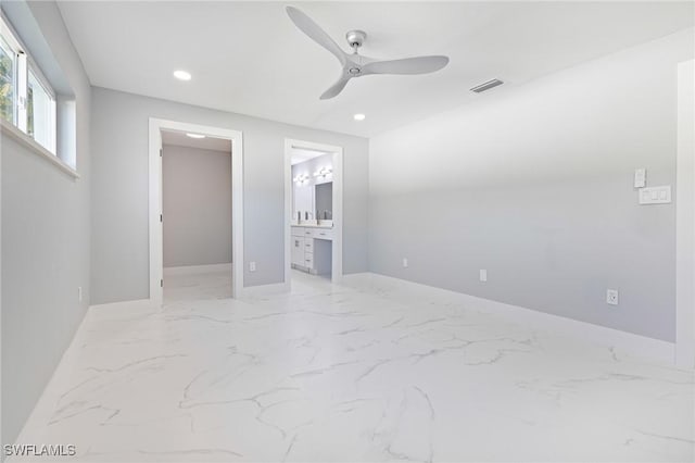 unfurnished bedroom featuring a spacious closet, marble finish floor, baseboards, visible vents, and recessed lighting