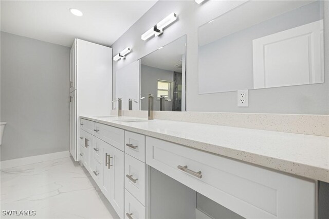 full bath featuring baseboards, marble finish floor, recessed lighting, and vanity