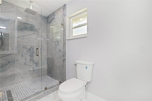bathroom with marble finish floor, a marble finish shower, and toilet