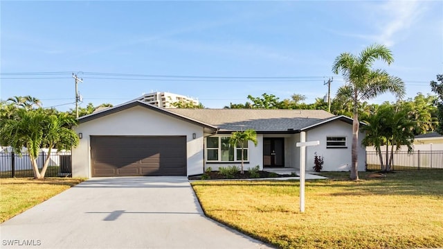 ranch-style house with fence, a front lawn, concrete driveway, stucco siding, and a garage