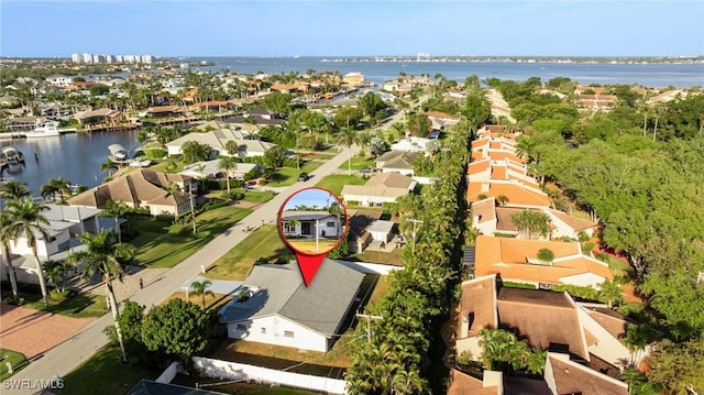 bird's eye view with a residential view and a water view