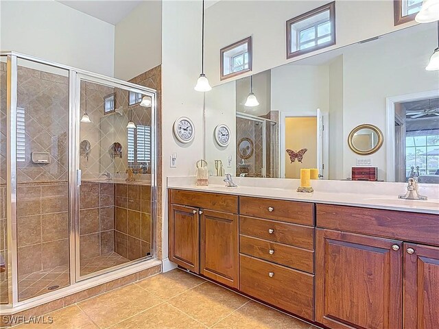 13011 Milford Pl, Fort Myers, FL 33913 - bathroom with a shower stall, double vanity, tile patterned flooring, and a sink