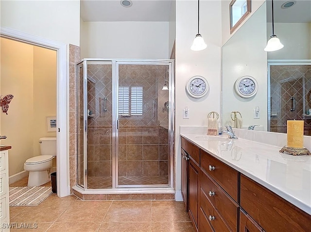 13011 Milford Pl, Fort Myers, FL 33913 - full bathroom featuring vanity, toilet, tile patterned floors, and a shower stall