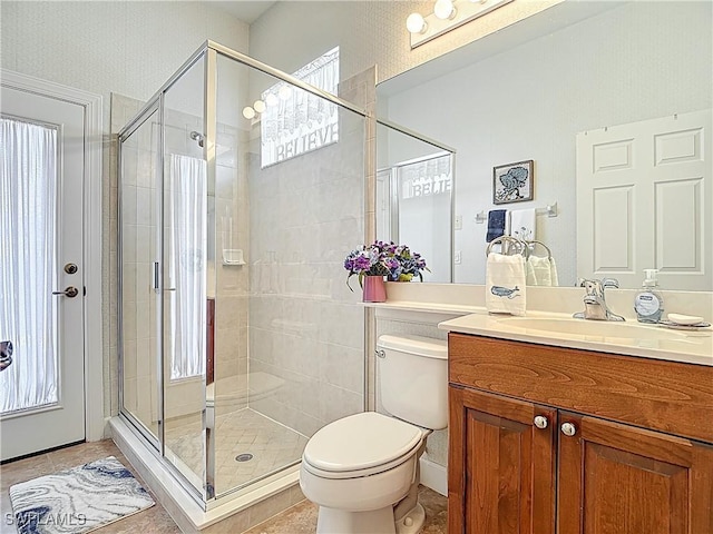 13011 Milford Pl, Fort Myers, FL 33913 - full bath with vanity, toilet, tile patterned floors, and a shower stall