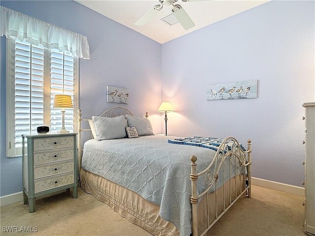 13011 Milford Pl, Fort Myers, FL 33913 - bedroom featuring baseboards, carpet flooring, and a ceiling fan