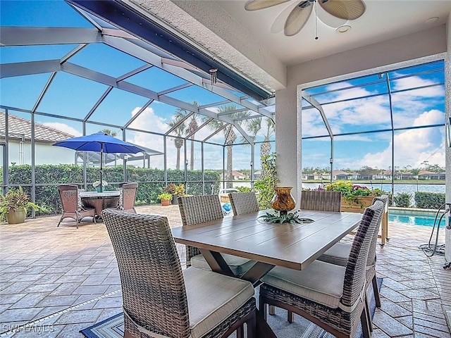 13011 Milford Pl, Fort Myers, FL 33913 - view of patio with outdoor dining area, a lanai, ceiling fan, and an outdoor pool