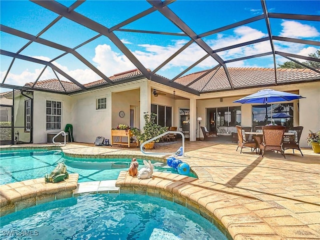 13011 Milford Pl, Fort Myers, FL 33913 - view of pool with a pool with connected hot tub, ceiling fan, and a patio