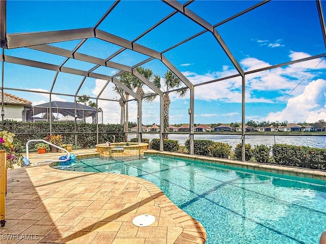 13011 Milford Pl, Fort Myers, FL 33913 - view of swimming pool with a pool with connected hot tub, a water view, a lanai, and a patio